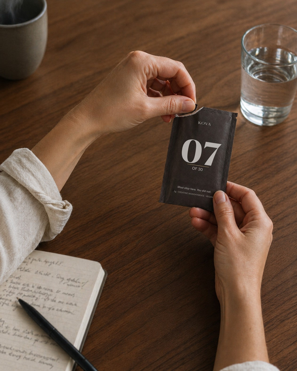 The KOVA kit — vessel, sleeve, and 30 numbered sachets